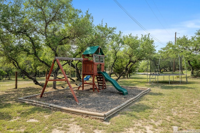 102 Kendall View Dr, Boerne, TX 78006 - community jungle gym featuring a trampoline, a yard, and view of wooded area