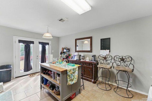 10715 Black Wolf Bay, San Antonio, TX 78245 - dining room with french doors and light tile patterned flooring