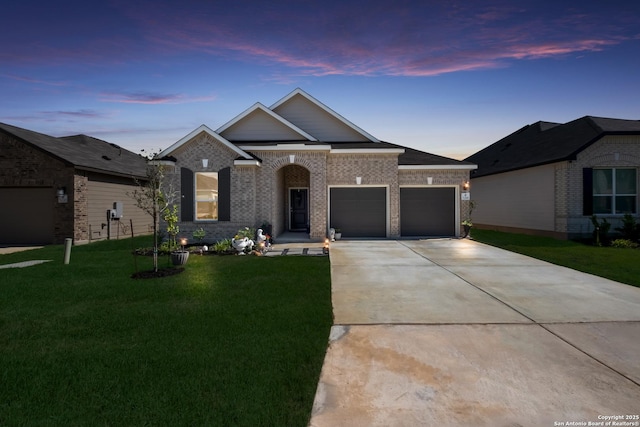 5266 Anzueto, San Antonio, TX 78261 - view of front of property featuring an attached garage, a yard, concrete driveway, and brick siding