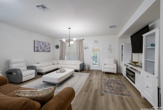 5266 Anzueto, San Antonio, TX 78261 - living area featuring wood finished floors and a chandelier
