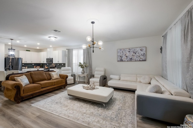 5266 Anzueto, San Antonio, TX 78261 - living area featuring a chandelier, wood finished floors, and recessed lighting