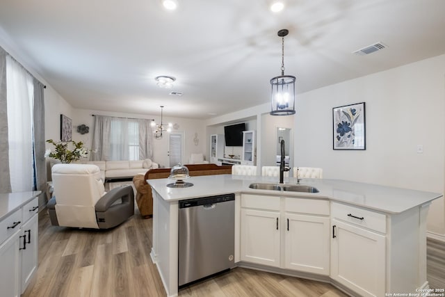 5266 Anzueto, San Antonio, TX 78261 - kitchen with dishwasher, a sink, open floor plan, and light countertops