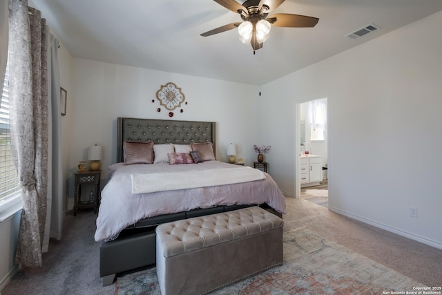 5266 Anzueto, San Antonio, TX 78261 - bedroom featuring light carpet, ensuite bathroom, baseboards, and a ceiling fan