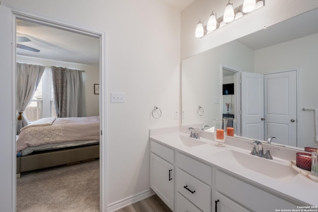 5266 Anzueto, San Antonio, TX 78261 - ensuite bathroom featuring double vanity and baseboards