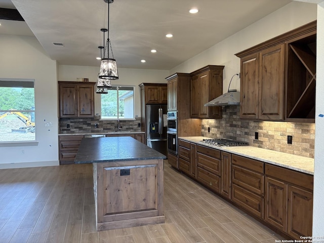 811 Horseshoe Fls, Bandera, TX 78003 - kitchen featuring stainless steel appliances, recessed lighting, a center island, light wood finished floors, and open shelves