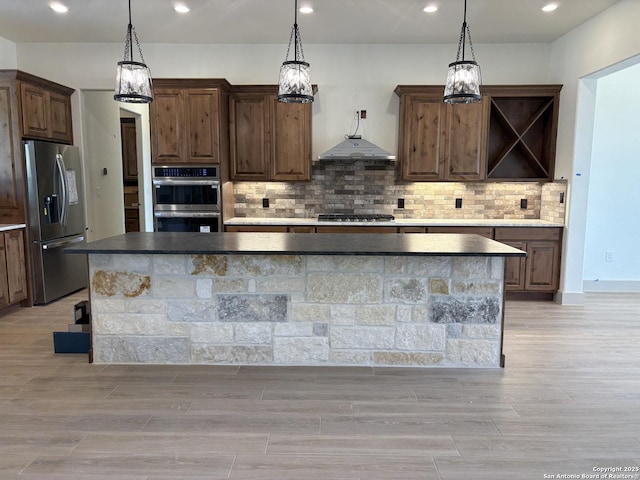 811 Horseshoe Fls, Bandera, TX 78003 - kitchen featuring stainless steel appliances, open shelves, recessed lighting, a large island with sink, and tasteful backsplash
