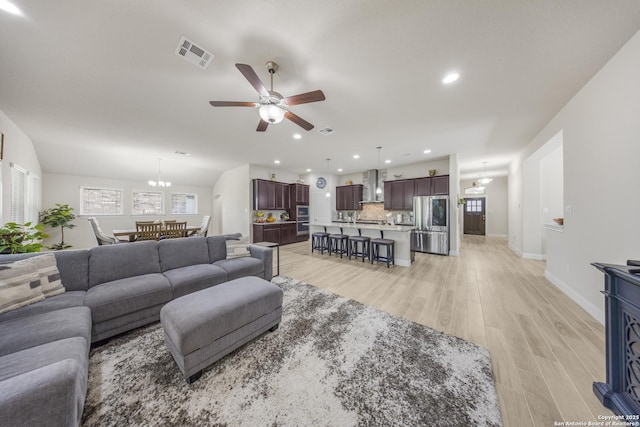 12322 Saddle Up Dr, San Antonio, TX 78254 - living area featuring a ceiling fan, light wood-type flooring, recessed lighting, baseboards, and a chandelier