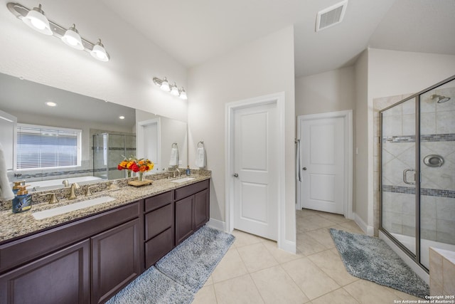 12322 Saddle Up Dr, San Antonio, TX 78254 - full bathroom featuring a stall shower, double vanity, a bath, tile patterned floors, and baseboards