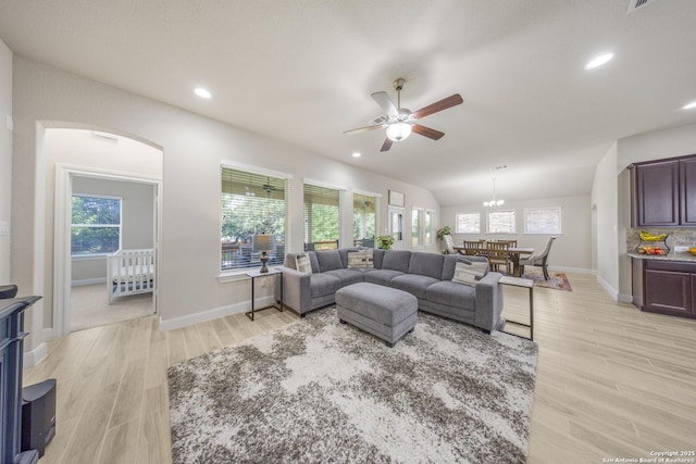 12322 Saddle Up Dr, San Antonio, TX 78254 - living room featuring a ceiling fan, light wood finished floors, baseboards, recessed lighting, and arched walkways