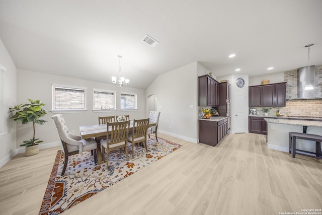 12322 Saddle Up Dr, San Antonio, TX 78254 - dining area with light wood-style flooring, a chandelier, baseboards, recessed lighting, and lofted ceiling