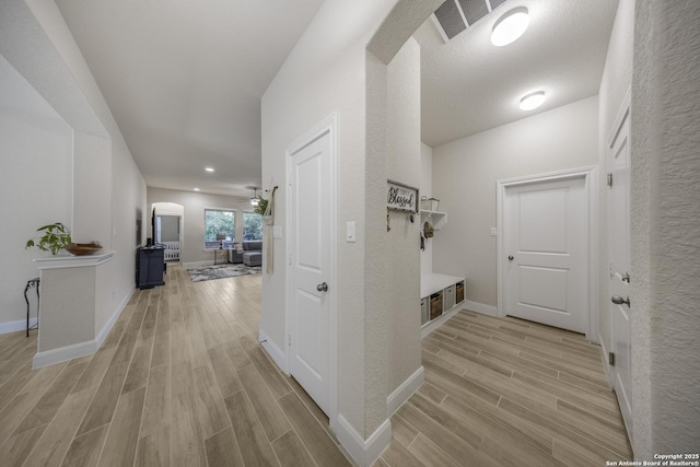12322 Saddle Up Dr, San Antonio, TX 78254 - hall featuring light wood finished floors, baseboards, and recessed lighting