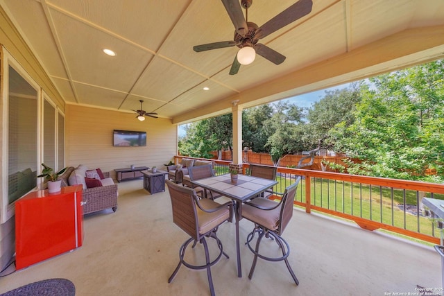 12322 Saddle Up Dr, San Antonio, TX 78254 - fenced backyard with ceiling fan, a patio area, outdoor dining area, and outdoor lounge area