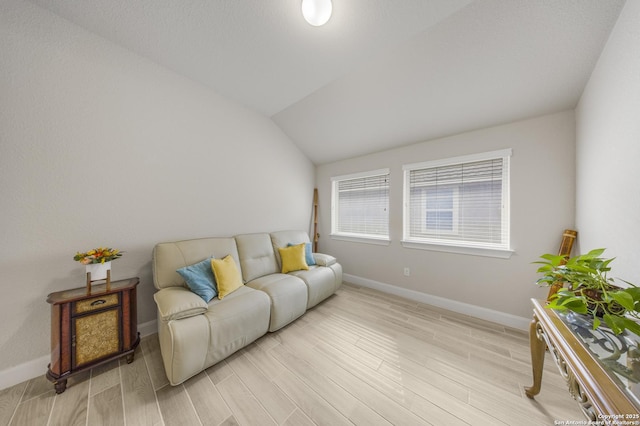 12322 Saddle Up Dr, San Antonio, TX 78254 - living room featuring light wood finished floors, baseboards, and lofted ceiling