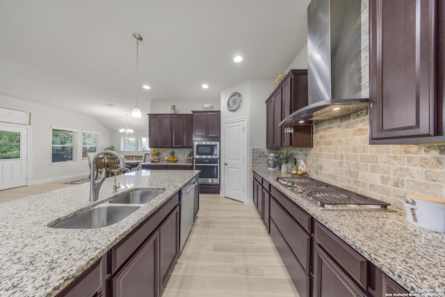 12322 Saddle Up Dr, San Antonio, TX 78254 - kitchen with wall chimney range hood, a sink, appliances with stainless steel finishes, decorative backsplash, and pendant lighting