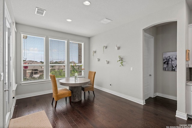 3130 Running Fawn, San Antonio, TX 78261 - dining room with arched walkways, dark wood-style floors, baseboards, and recessed lighting