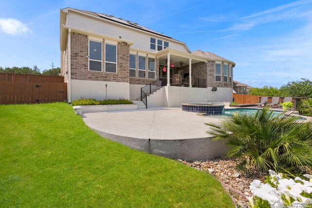 3130 Running Fawn, San Antonio, TX 78261 - rear view of house with brick siding, ceiling fan, a pool with connected hot tub, a patio, and central AC unit