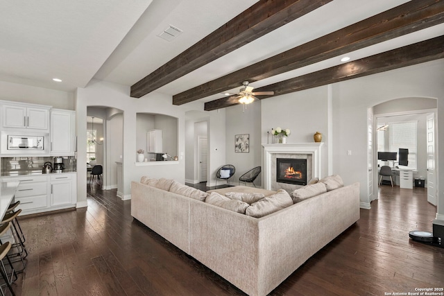 3130 Running Fawn, San Antonio, TX 78261 - living area with arched walkways, baseboards, dark wood-style floors, recessed lighting, and ceiling fan