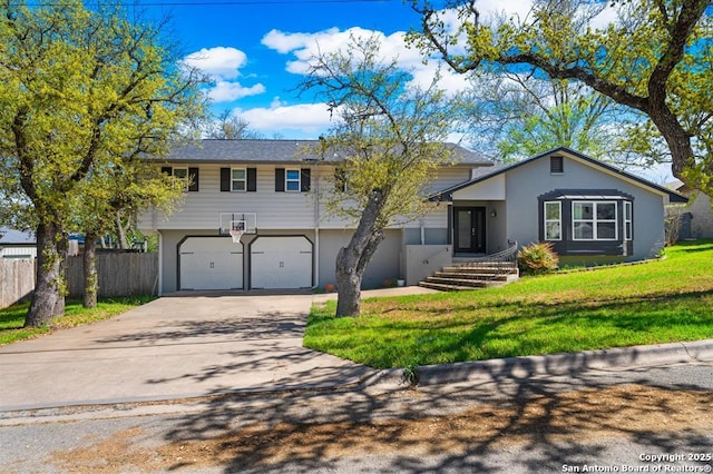 711 Cardinal Dr, Kerrville, TX 78028 - view of front of home featuring driveway, an attached garage, and stucco siding