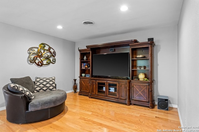 711 Cardinal Dr, Kerrville, TX 78028 - living area with wood finished floors, baseboards, and recessed lighting