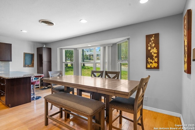 711 Cardinal Dr, Kerrville, TX 78028 - dining area with plenty of natural light, light wood finished floors, recessed lighting, and baseboards