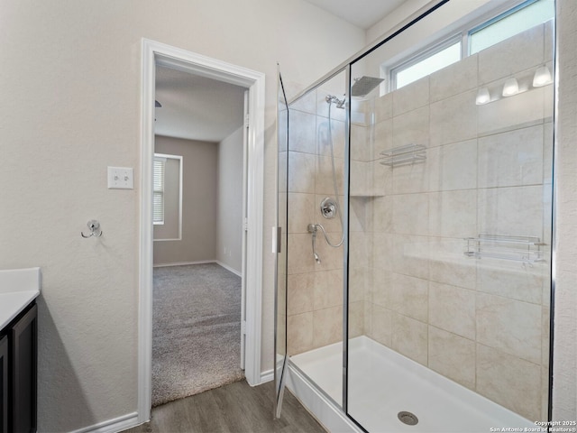 10518 Green Rock, San Antonio, TX 78223 - full bathroom with plenty of natural light, a stall shower, wood finished floors, and vanity
