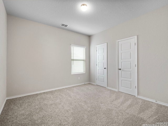 10518 Green Rock, San Antonio, TX 78223 - unfurnished bedroom featuring carpet flooring and baseboards