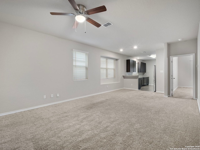 10518 Green Rock, San Antonio, TX 78223 - unfurnished living room featuring light carpet, baseboards, ceiling fan, and recessed lighting