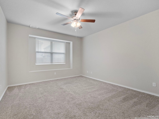 10518 Green Rock, San Antonio, TX 78223 - carpeted empty room with a ceiling fan and baseboards
