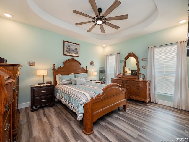 2872 Lakeview Dr, Canyon Lake, TX 78133 - bedroom featuring dark wood-style floors, a raised ceiling, recessed lighting, baseboards, and ceiling fan