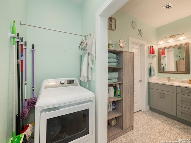 2872 Lakeview Dr, Canyon Lake, TX 78133 - washroom with washer / dryer, a sink, and light tile patterned floors