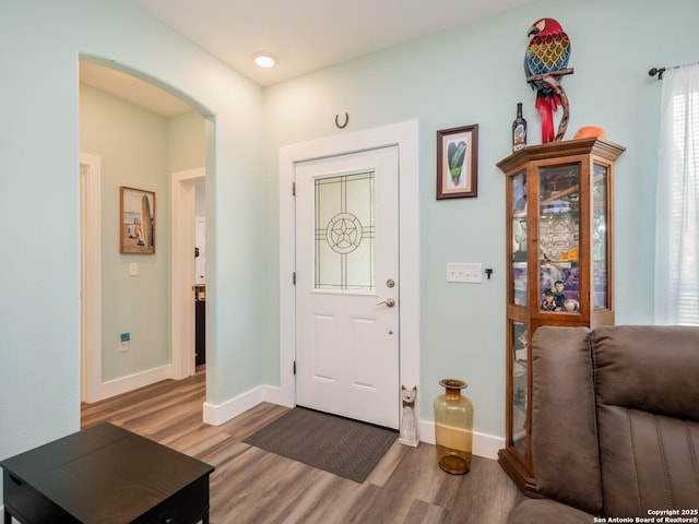 2872 Lakeview Dr, Canyon Lake, TX 78133 - foyer with light wood-type flooring, arched walkways, and baseboards
