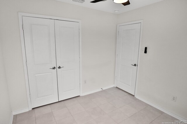 8517 Barefoot Ln, Converse, TX 78109 - unfurnished bedroom featuring a closet, baseboards, and ceiling fan