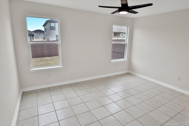 8517 Barefoot Ln, Converse, TX 78109 - spare room featuring a ceiling fan, baseboards, and tile patterned flooring