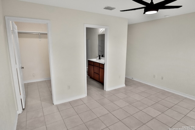 8517 Barefoot Ln, Converse, TX 78109 - unfurnished bedroom featuring light tile patterned flooring, a closet, and baseboards