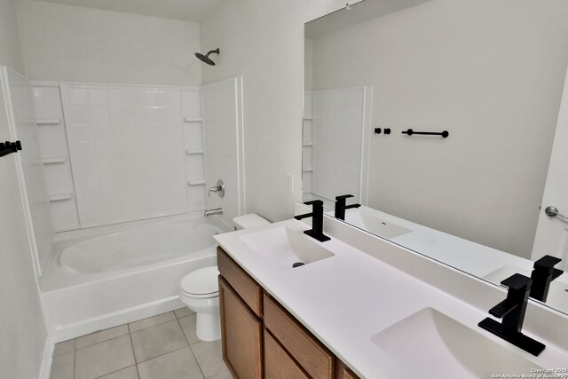 8517 Barefoot Ln, Converse, TX 78109 - bathroom featuring toilet, double vanity, tile patterned floors, and shower / tub combination