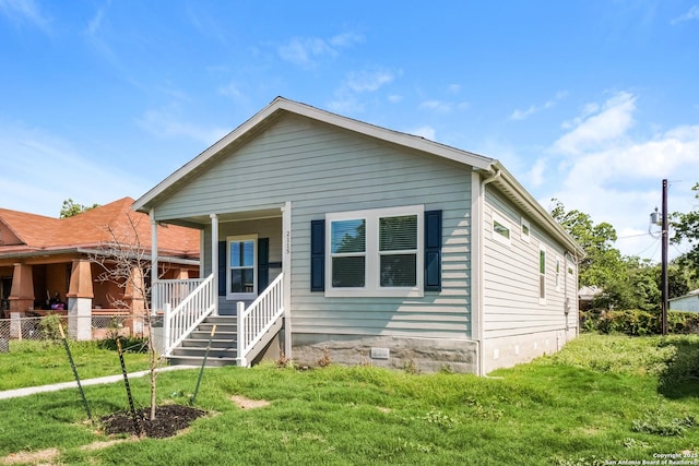 2115 W Houston, San Antonio, TX 78207 - view of front of home featuring a front lawn and a porch