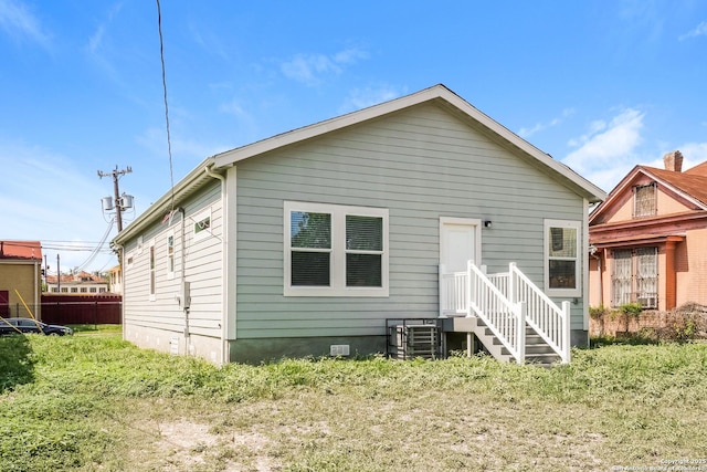 2115 W Houston, San Antonio, TX 78207 - rear view of property with central air condition unit and crawl space