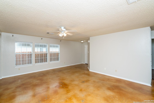 5731 Bypass Trl, San Antonio, TX 78244 - empty room featuring finished concrete floors, a ceiling fan, baseboards, and a textured ceiling