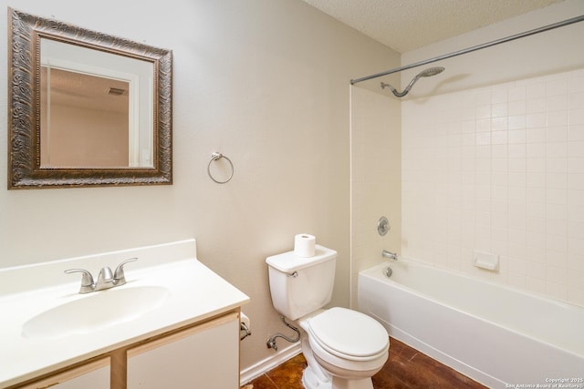 5731 Bypass Trl, San Antonio, TX 78244 - full bath featuring toilet, vanity, tub / shower combination, a textured ceiling, and baseboards