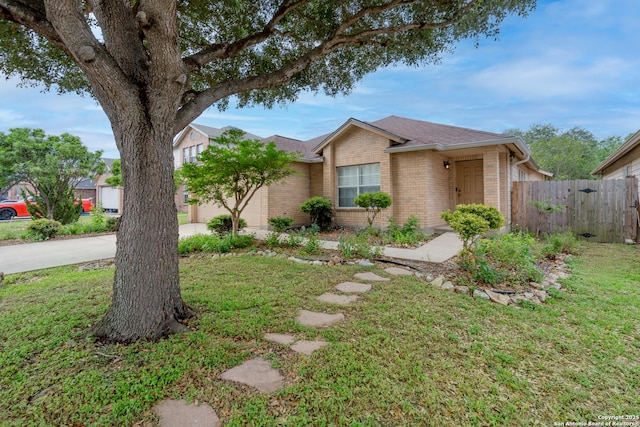 5731 Bypass Trl, San Antonio, TX 78244 - ranch-style house featuring brick siding, a garage, roof with shingles, and concrete driveway