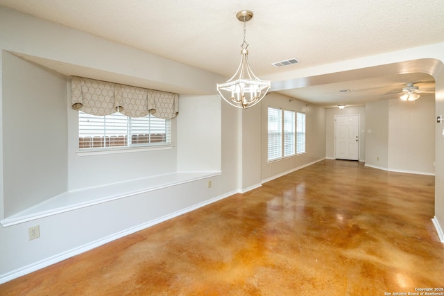 5731 Bypass Trl, San Antonio, TX 78244 - unfurnished dining area featuring a chandelier, concrete flooring, baseboards, and ceiling fan