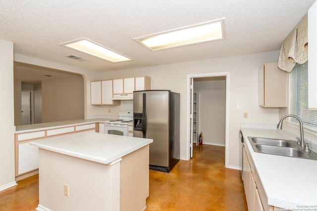 5731 Bypass Trl, San Antonio, TX 78244 - kitchen with stainless steel fridge, electric range, a sink, under cabinet range hood, and light countertops