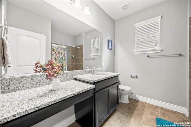 10218 Nate Range, San Antonio, TX 78254 - full bathroom featuring vanity, baseboards, toilet, and a tile shower