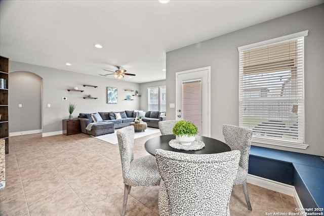 10218 Nate Range, San Antonio, TX 78254 - dining space featuring ceiling fan, arched walkways, baseboards, recessed lighting, and light tile patterned floors