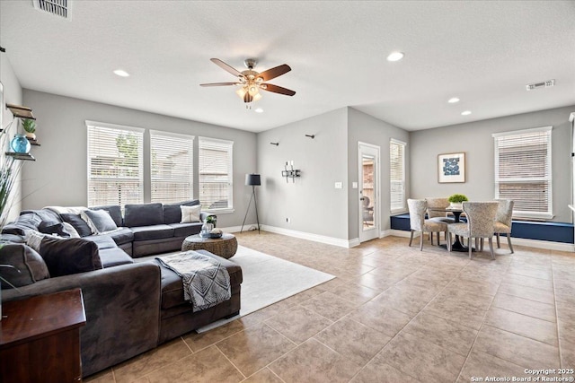 10218 Nate Range, San Antonio, TX 78254 - living area with ceiling fan, baseboards, recessed lighting, and light tile patterned flooring
