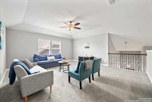 10218 Nate Range, San Antonio, TX 78254 - living area featuring ceiling fan, carpet flooring, a raised ceiling, baseboards, and a textured ceiling
