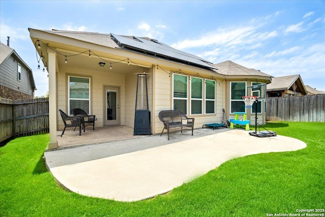 10218 Nate Range, San Antonio, TX 78254 - rear view of property featuring roof mounted solar panels and a patio area