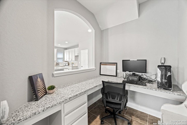 10218 Nate Range, San Antonio, TX 78254 - office with built in desk, tile patterned floors, and arched walkways