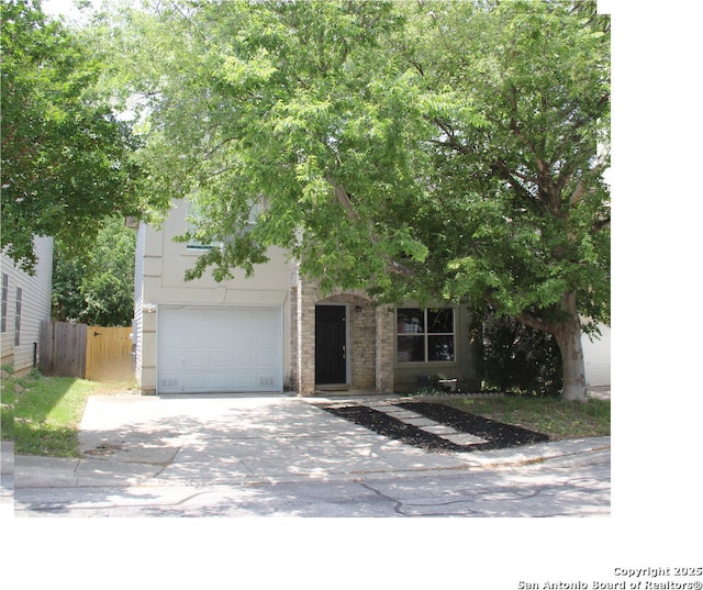39 Latrobe Post, San Antonio, TX 78240 - view of property hidden behind natural elements with a garage and driveway