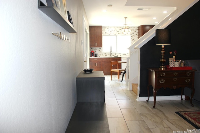 39 Latrobe Post, San Antonio, TX 78240 - hall featuring a sink, stairs, and recessed lighting